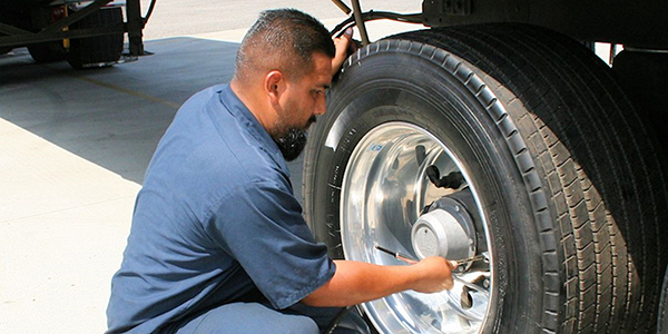 Bear Trucking, putting air in Yokohama tire